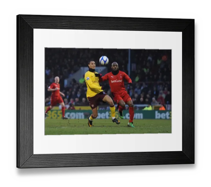 Framed Print : Marouane Chamakh (Arsenal) Terrell Forbes (Orient). Leyton Orient 1: 1 Arsenal