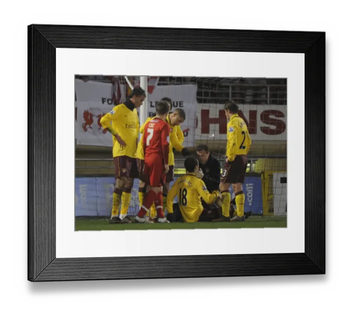 Framed Print : Sebastien Squillaci is treated by Arsenal physio Colin Lewin. Leyton Orient 1: 1 Arsenal Framed Print : Sebastien Squillaci is treated by Arsenal physio Colin Lewin. Leyton Orient 1: 1 Arsenal
