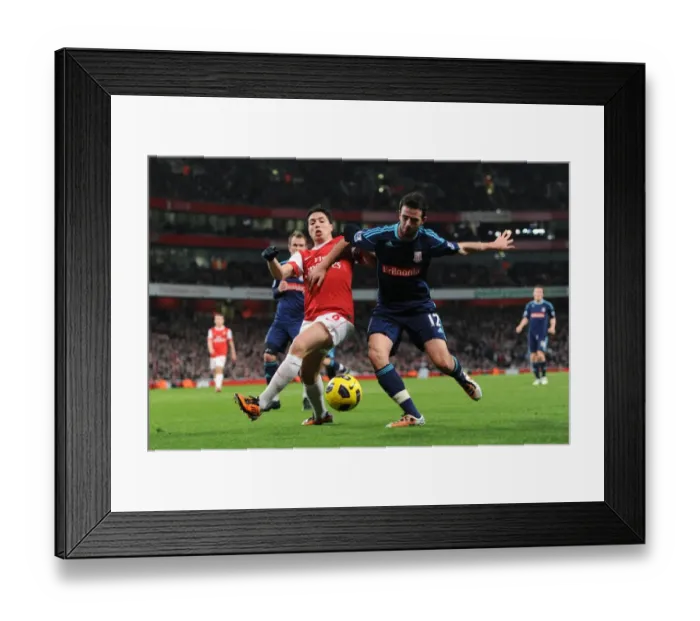 Framed Print : Samir Nasri (Arsenal) Marc Wilson (Stoke). Arsenal 1: 0 Stoke City. Barclays Premier League Framed Print : Samir Nasri (Arsenal) Marc Wilson (Stoke). Arsenal 1: 0 Stoke City. Barclays Premier League