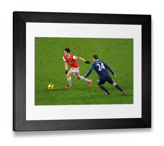 Framed Print : Samir Nasri (Arsenal) Rory Delap (Stoke). Arsenal 1: 0 Stoke City. Barclays Premier League Framed Print : Samir Nasri (Arsenal) Rory Delap (Stoke). Arsenal 1: 0 Stoke City. Barclays Premier League