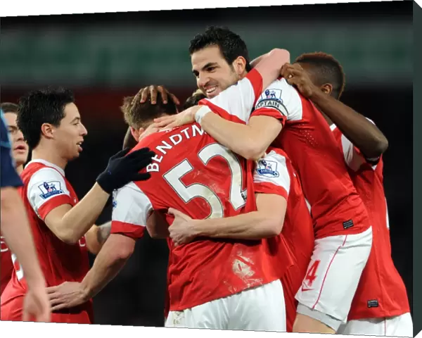 Sebastien Squillaci celebrates scoring for Arsenal with his team mates including Cesc Fabregas