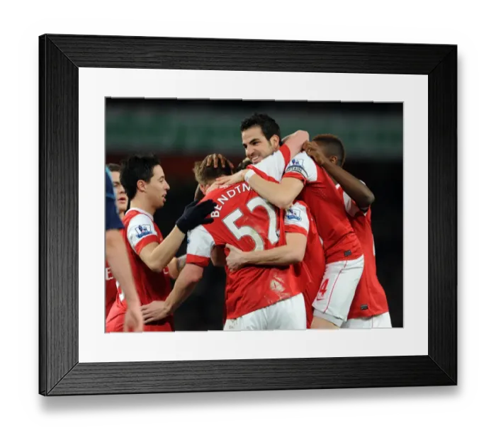 Framed Print : Sebastien Squillaci celebrates scoring for Arsenal with his team mates including Cesc Fabregas