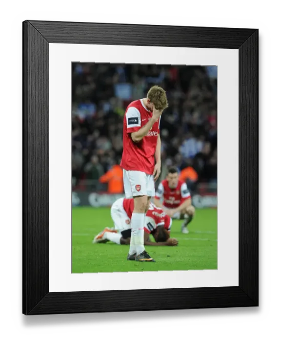 Framed Print : Dejected Nicklas Bendtner: Arsenal's Carling Cup Final Defeat against Birmingham City (2011) Framed Print : Dejected Nicklas Bendtner: Arsenal's Carling Cup Final Defeat against Birmingham City (2011)