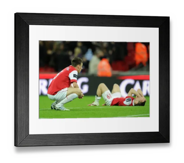 Framed Print : Laurent Koscielny (Arsenal) dejected after the match. Arsenal 1: 2 Birmingham City Framed Print : Laurent Koscielny (Arsenal) dejected after the match. Arsenal 1: 2 Birmingham City