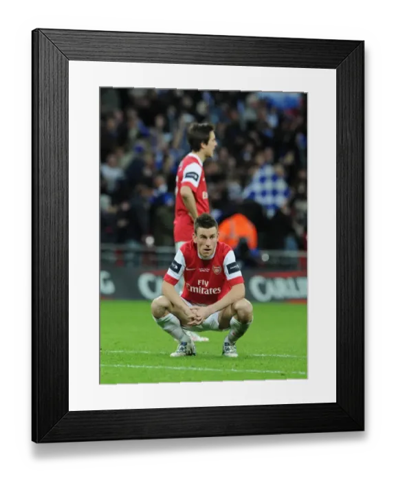 Framed Print : Dejected Arsenal defender Laurent Koscielny. Arsenal 1: 2 Birmingham City