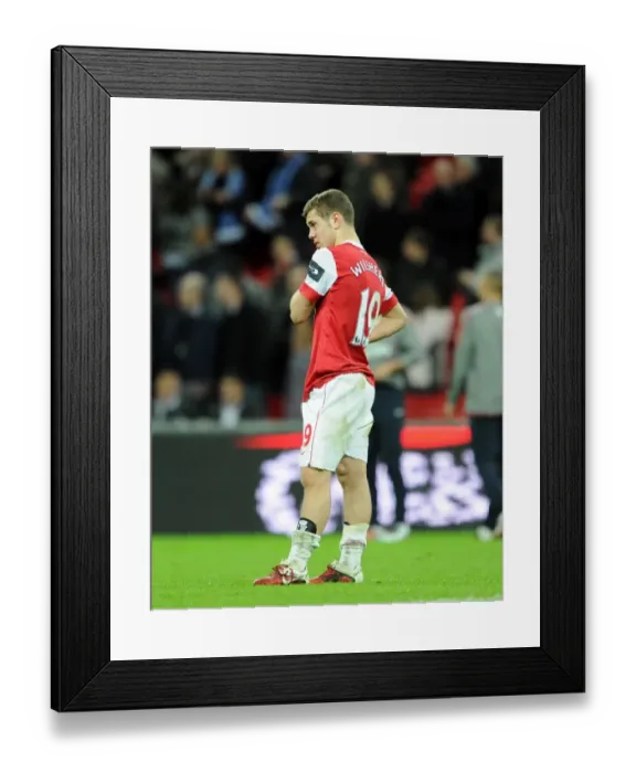 Framed Print : Jack Wilshere (Arsenal) is dejected at the final whistle. Arsenal 1: 2 Birmingham City