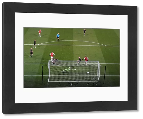 Marouane Chamakh shoots past Orient goalkeeper Jamie Jones to score the 1st Arsenal goal