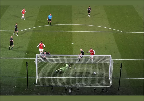 Marouane Chamakh shoots past Orient goalkeeper Jamie Jones to score the 1st Arsenal goal