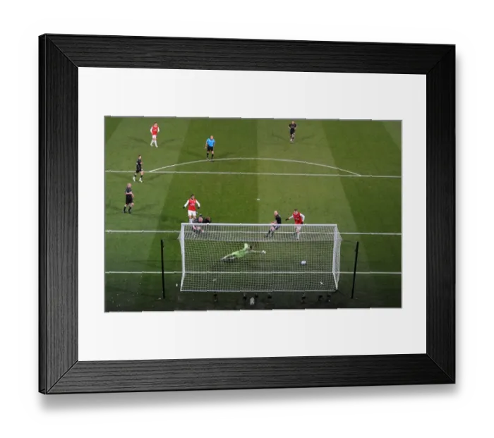 Framed Print : Marouane Chamakh shoots past Orient goalkeeper Jamie Jones to score the 1st Arsenal goal