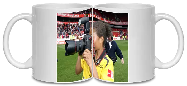 Rachel Yankey (Arsenal) takes a few pictures after the match