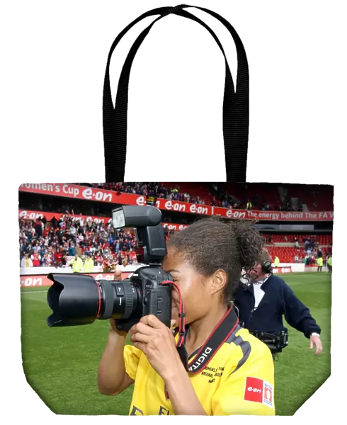Rachel Yankey (Arsenal) takes a few pictures after the match