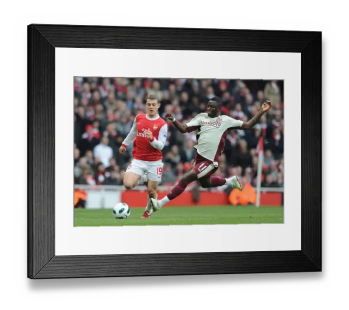 Framed Print : Arsenal vs Sunderland: Jack Wilshere vs Sulley Muntari Stalemate at Emirates Stadium, Premier League 2010-11 Framed Print : Arsenal vs Sunderland: Jack Wilshere vs Sulley Muntari Stalemate at Emirates Stadium, Premier League 2010-11