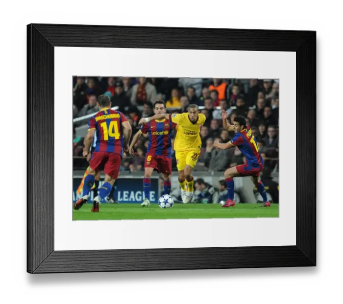 Framed Print : Gael Clichy (Arsenal) takes on Xavi and Pedro Rodriguez (Barcelona). Barcelona 3