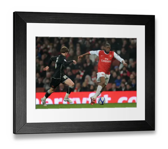 Framed Print : Abou Diaby and Thomas Carroll Clash in Arsenal's 5-0 FA Cup Victory over Leyton Orient