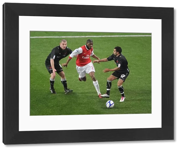 Abou Diaby (Arsenal) Stephen Dawson and Jason Crowe (Orient). Arsenal 5: 0 Leyton Orient
