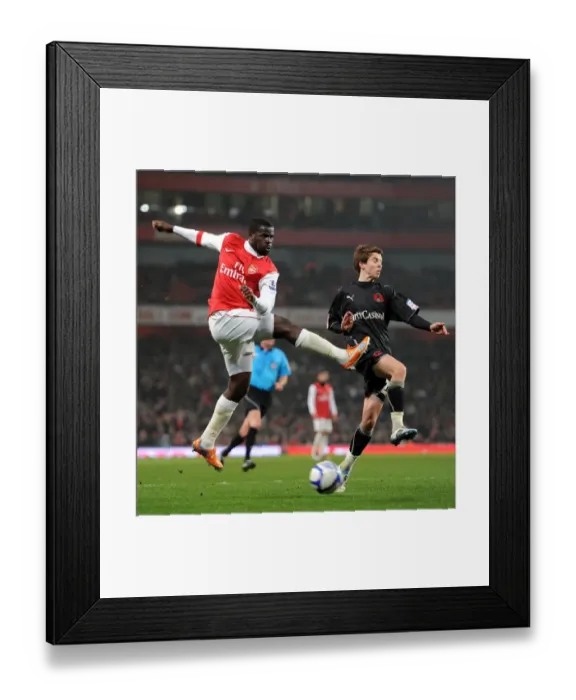 Framed Print : Emmanuel Eboue (Arsenal) Thomas Carroll (Orient). Arsenal 5: 0 Leyton Orient