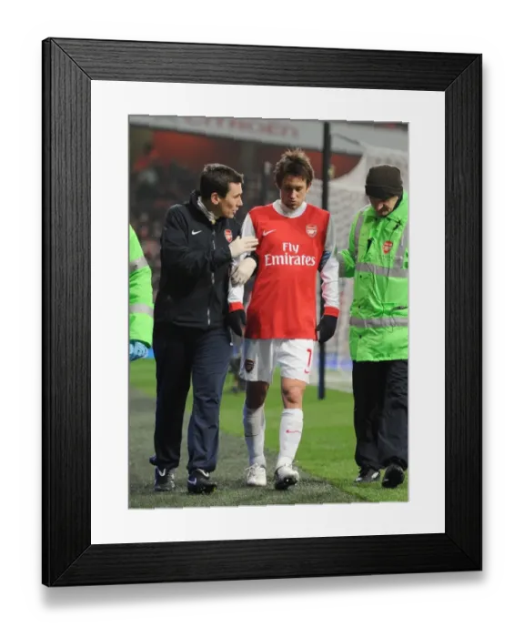 Framed Print : Tomas Rosicky is treated by Arsenla doctor Gary O Driscoll. Arsenal 5: 0 Leyton Orient