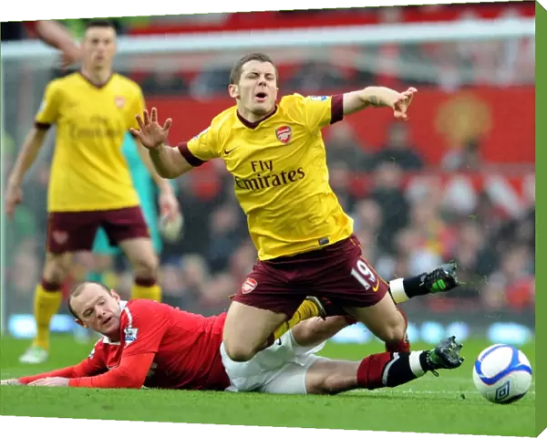 Jack Wilshere (Arsenal) is fouled by Wayne Rooney (Man Utd). Manchester United 2