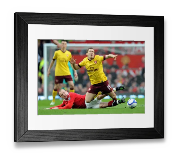 Framed Print : Jack Wilshere (Arsenal) is fouled by Wayne Rooney (Man Utd). Manchester United 2 Framed Print : Jack Wilshere (Arsenal) is fouled by Wayne Rooney (Man Utd). Manchester United 2