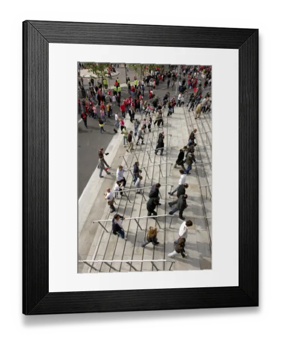 Framed Print : Arsenal fans walk up the the stadium before the match Framed Print : Arsenal fans walk up the the stadium before the match