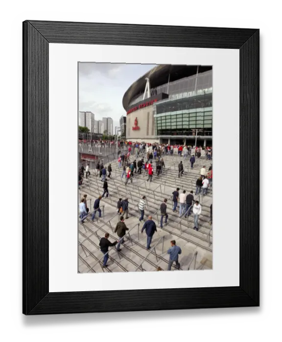 Framed Print : Arsenal fans walk up the the stadium before the match