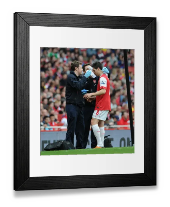 Framed Print : Samir Nasri (Arsenal) with physio Colin Lewin. Arsenal 0: 0 Blackburn Rovers