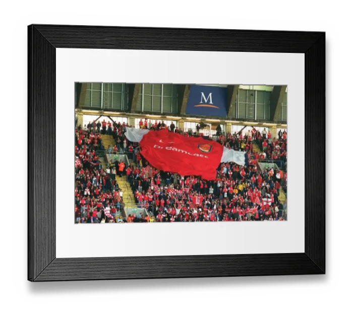 Framed Print : Arsenal fans pass over the giant shirt. Arsenal 2: 0 Chelsea. The AXA F Framed Print : Arsenal fans pass over the giant shirt. Arsenal 2: 0 Chelsea. The AXA F