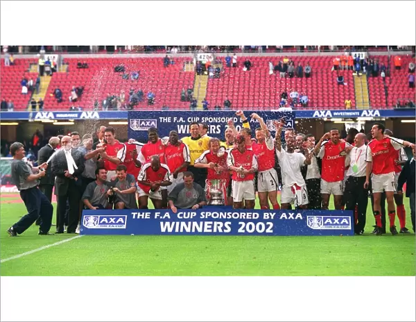 The Arsneal squad celebrate the FA Cup Final win after the match