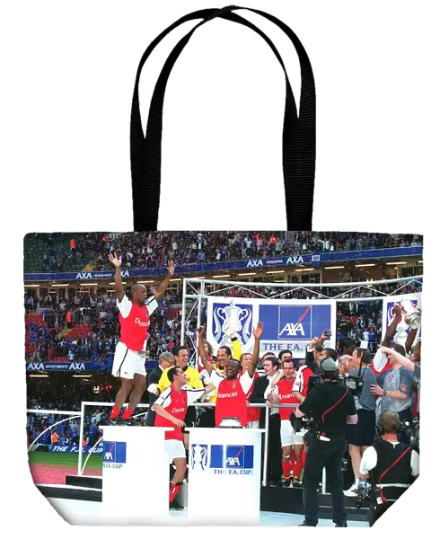 Arsenal players celebrate after winning the FA Cup