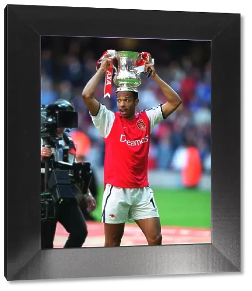 Thierry Henry with the FA Cup after the match