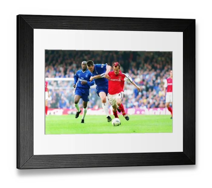 Framed Print : Fredrik Ljungberg breaks past John Terry to score the 2nd Arsenal goal Framed Print : Fredrik Ljungberg breaks past John Terry to score the 2nd Arsenal goal