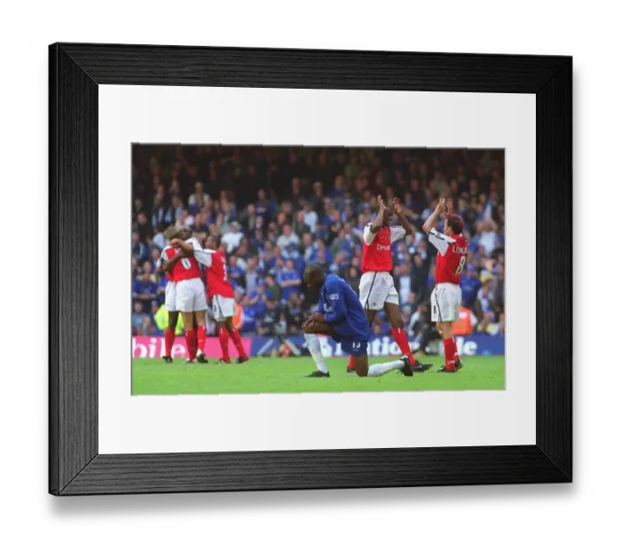 Framed Print : Patrick Vieira and Fredrik Ljungberg celebrate the Arsenal victory as dejected Chelsea defender Will Framed Print : Patrick Vieira and Fredrik Ljungberg celebrate the Arsenal victory as dejected Chelsea defender Will