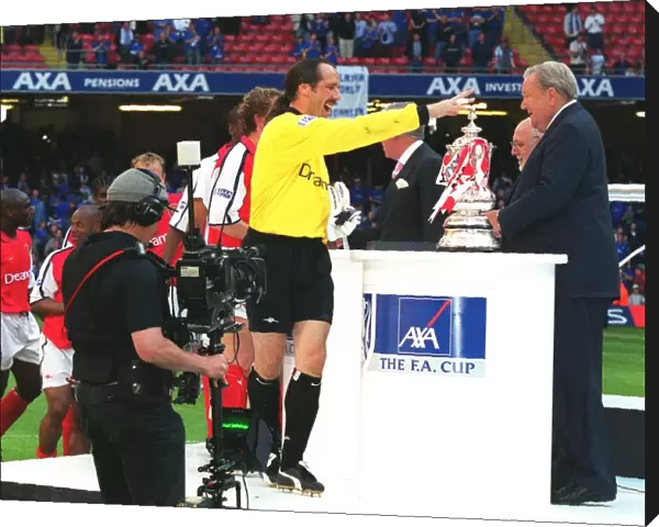 Arsenal goalkeeper David Seaman collects his medal from Leonart Johanssen