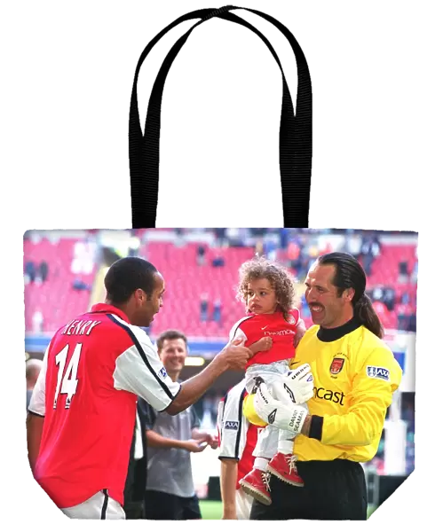 Arsenal goalkeeper David Seaman with daughter Georgina and Thierry Henry after the match