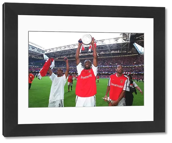 Patrick Vieira, Thierry Henry and Ashley Cole celebrate after the match
