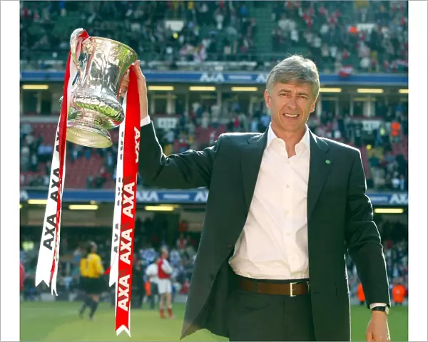 Arsenal manager Arsene Wenger lifts the FA Cup after the match