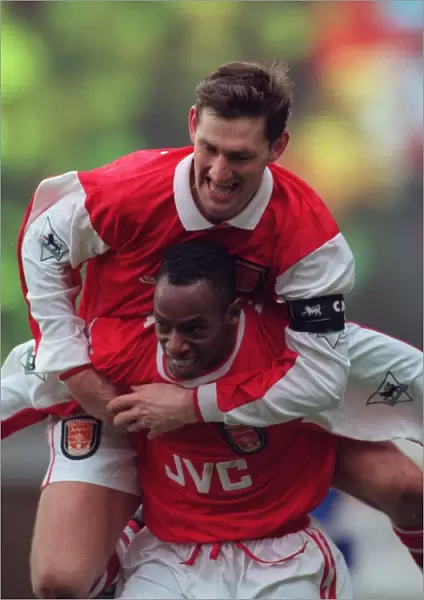 Tony Adams and Ian Wright celebrate an Arsenal goal