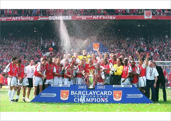 The Arsenal team celebrate winning the F. A. Barclaycard Premiership