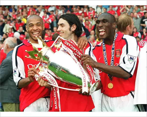 Sol Campbell, Robert Pires and Thierry Henry with the F. A