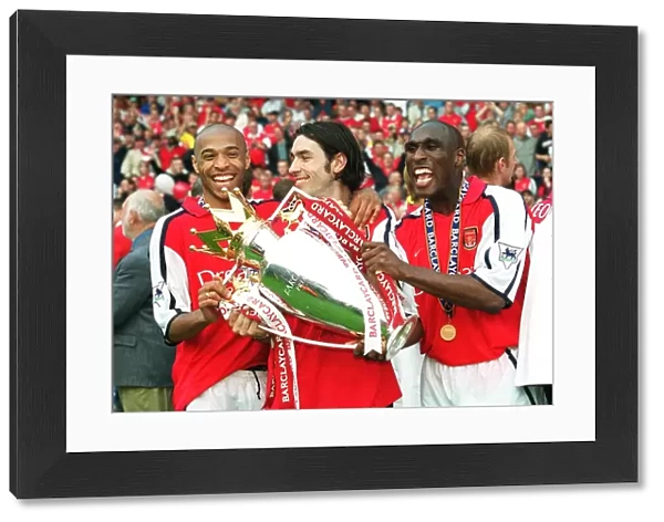 Sol Campbell, Robert Pires and Thierry Henry with the F. A