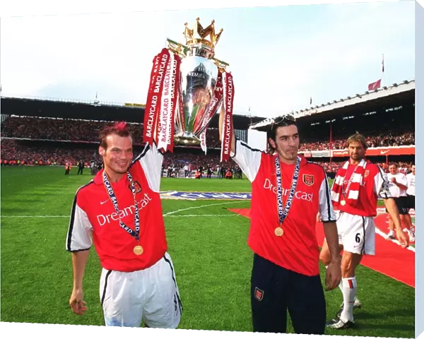 Fredrik Ljungberg and Robert Pires (Arsenal) lift the F. A
