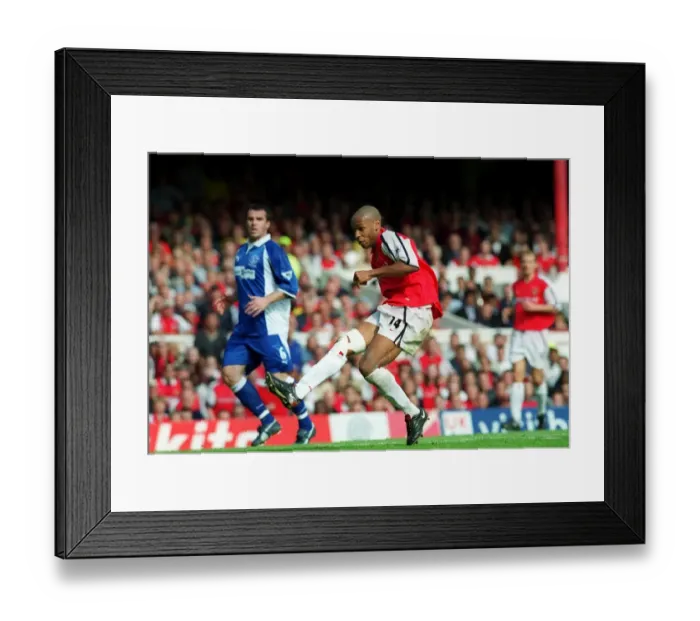 Framed Print : Thierry Henry shoots past Everton goalkeeper Steve Simonsen to score his 2nd Framed Print : Thierry Henry shoots past Everton goalkeeper Steve Simonsen to score his 2nd