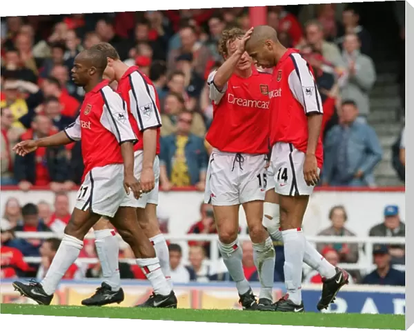 Thierry Henry is congratulated by Ray Parlour on scoring his 2nd Arsenal goal