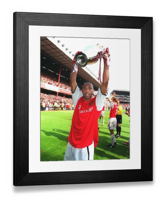 Framed Print : Thierry Henry Celebrates with the FA Barclaycard Premiership Trophy after Arsenal's 4:3 Win over Everton, Highbury, London, May 11, 2002 Framed Print : Thierry Henry Celebrates with the FA Barclaycard Premiership Trophy after Arsenal's 4:3 Win over Everton, Highbury, London, May 11, 2002