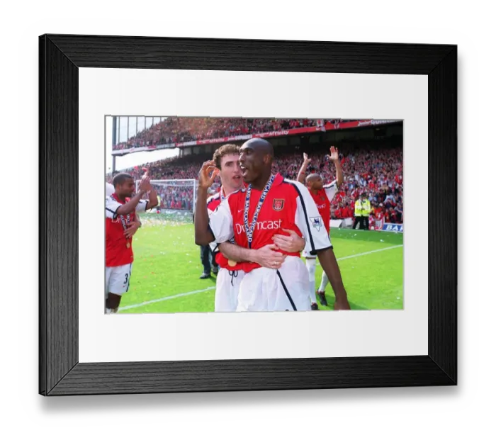 Framed Print : Arsenal defenders Martin Keown and Sol Campbell celebrate after the match Framed Print : Arsenal defenders Martin Keown and Sol Campbell celebrate after the match