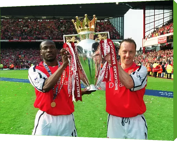 Lauren and Lee Dixon (Arsenal) lift the F. A. Barclaycard Premiership Trophy