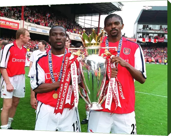 Lauren and Kanu lift the F. A. Barclaycard Premiership Trophy