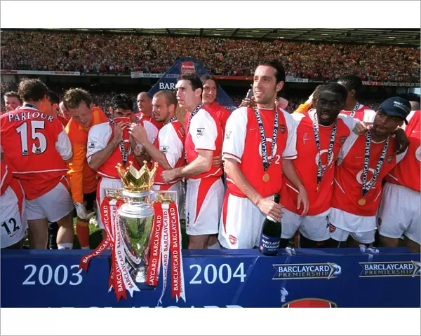 The Arsenal Players celebrate with the Premiership trophy