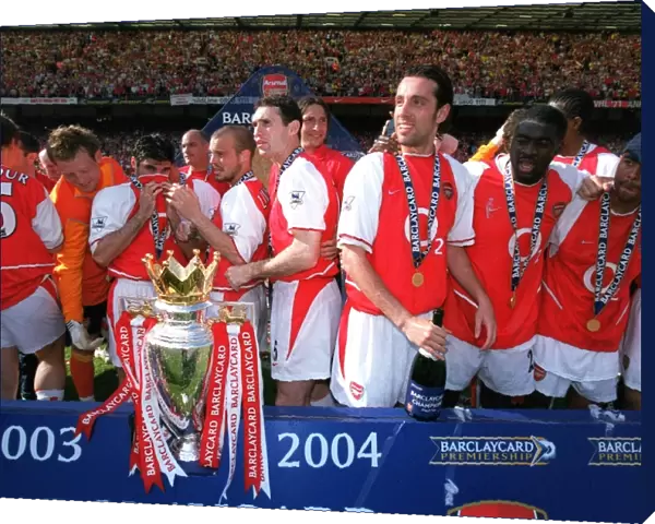 The Arsenal Players celebrate with the Premiership trophy