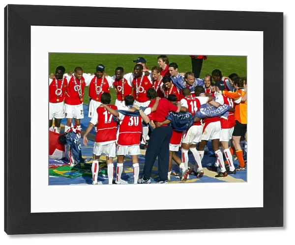 The Arsenal players celebrate at the end of the match